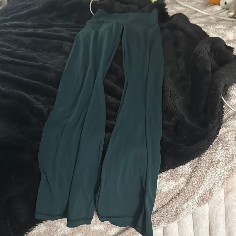 Green flared leggings